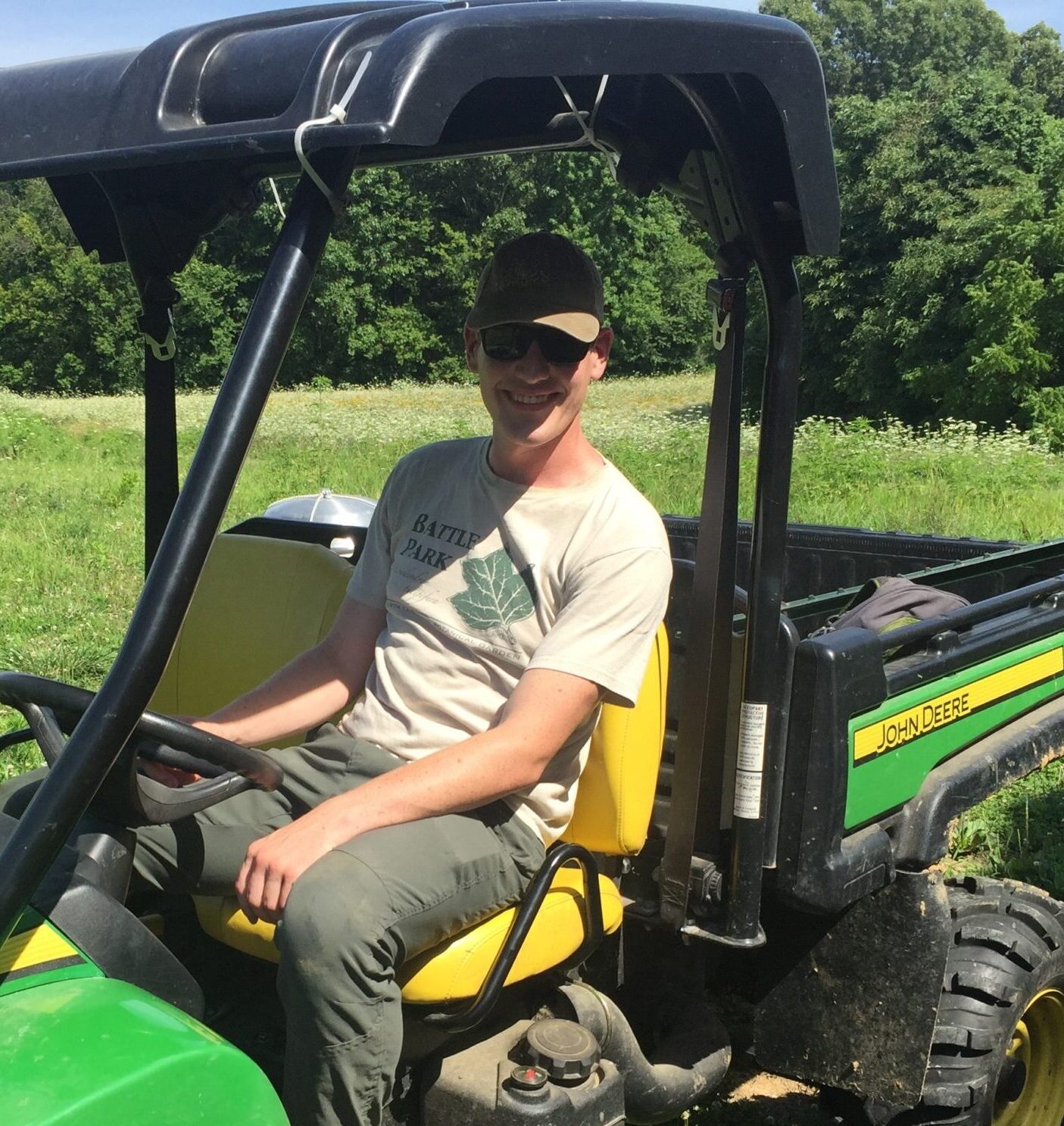 Matt riding green Gator